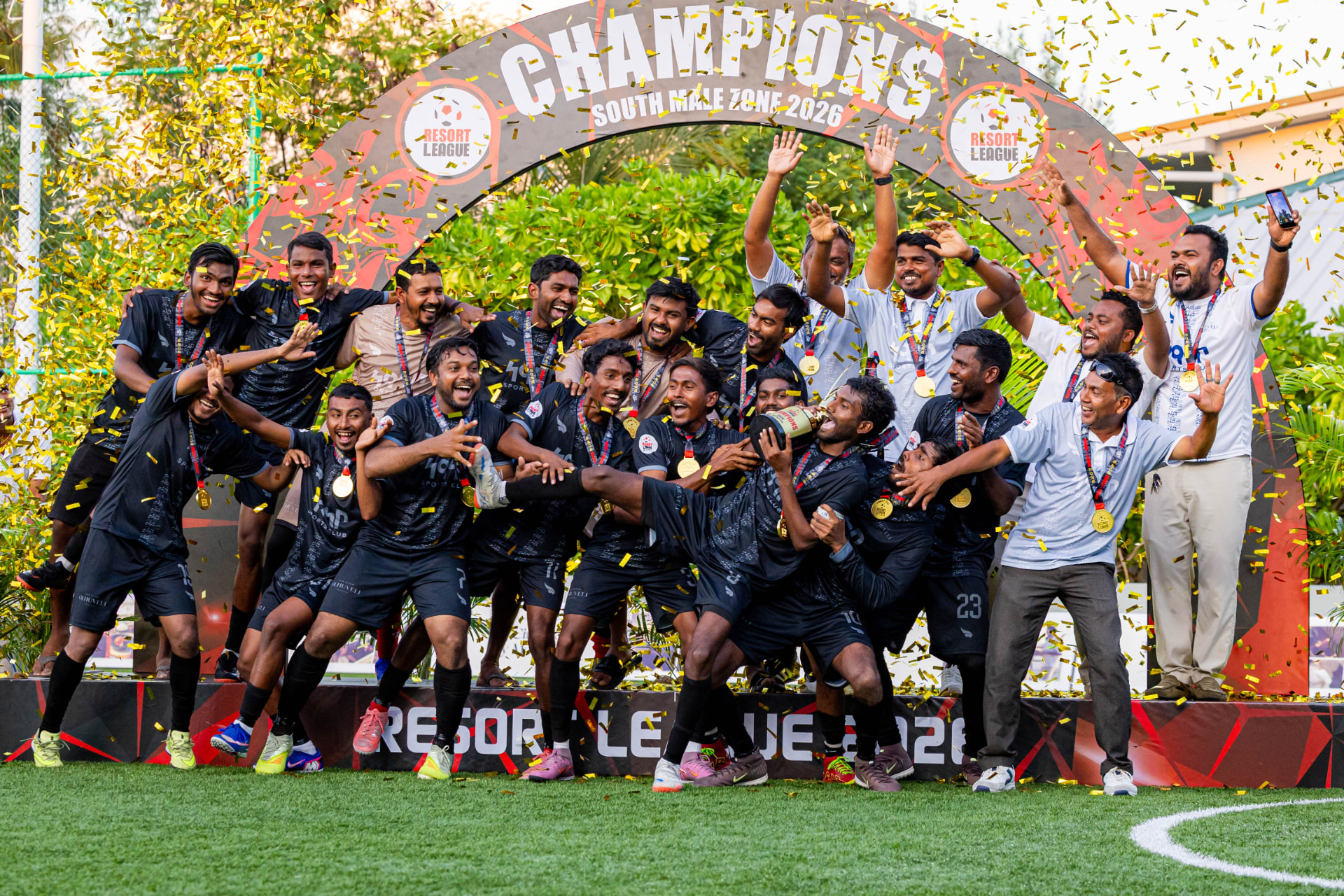 Resort League champions celebrating under gold confetti