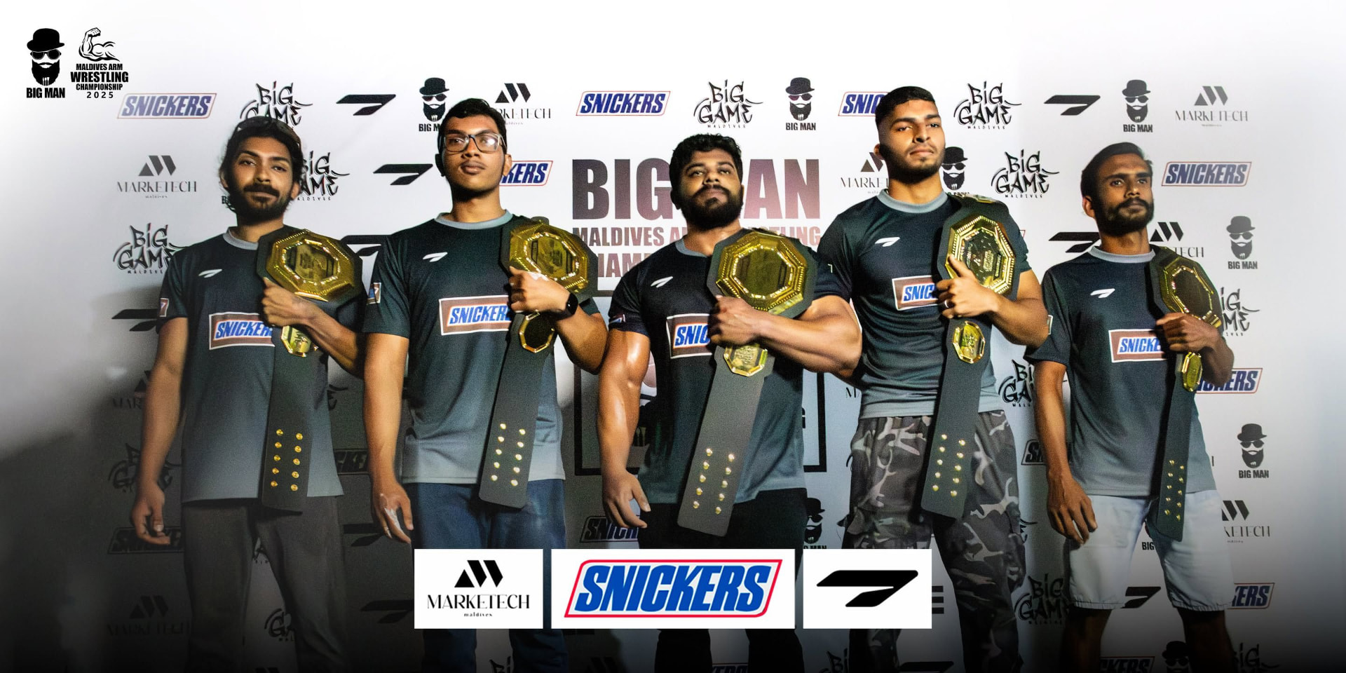 Maldives Arm Wrestling Championship belt winners on stage